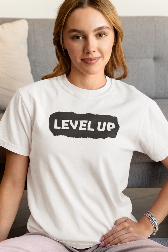 Woman wearing Level Up Women’s Tee with motivational text for LCSW & LMSW exam prep.